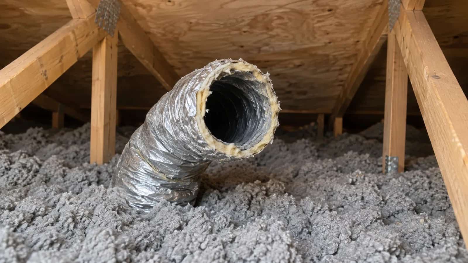 Open insulated flexible duct ending among attic framing and loose-fill insulation